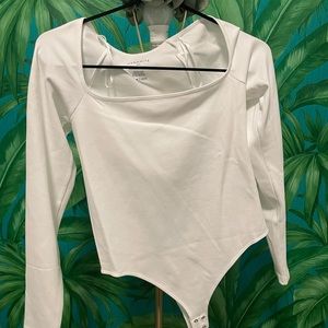Long sleeve white dynamite bodysuit